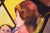 "Madam Suburbia" (Woman and Baby by the Yellow Window) in Oil on Canvas An auburn-haired woman sits in a chair with her...