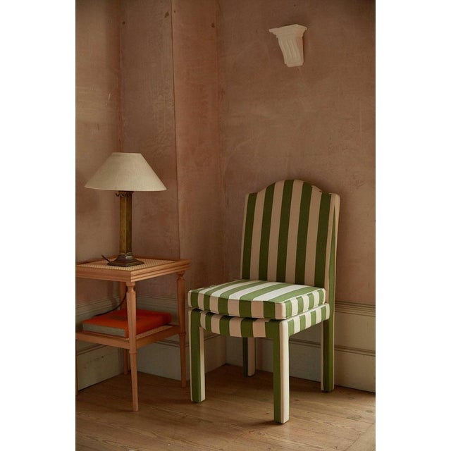 Our fully upholstered dining chair is a super chic addition to any dining table, and can sit just as well as a side or...