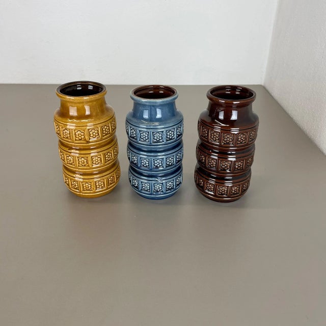 Set of three fat lava art vases Model: 268-18 Producer: Scheurich, Germany Decade: 1970s These original vintage vases was...