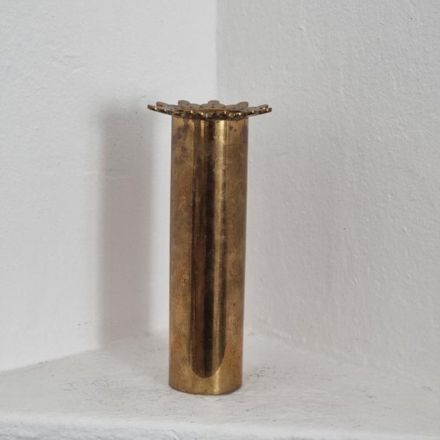 Beautiful vase in solid brass, the typical tubular shape by Pierre Forssell for Skultuna Bruk. Designed in mid-1900s, this...
