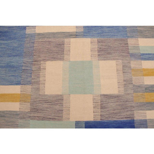 Add a touch of elegance to your home with this casual chic hand woven Tribal Kilim wool rug. Constructed on a loom by...