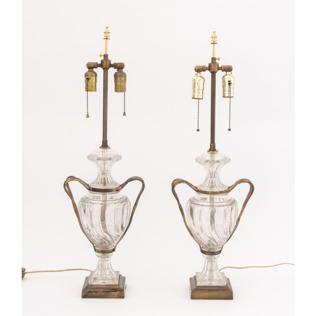 Pair of Regency Style Molded Clear Glass and Brass Lamps, each with twist form arms mounted on square brass base. 29.25" H...