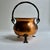 Mid 20th Century footed and handled hand-hammered Copper Cauldron. Planter. Pot. Vase. Featuring a rustic design with urn...