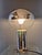 Rare table lamp, model 001391, by Motoko Ishii for Staff Lighting. Mirrored glass shade on a chrome base, 1970s. This...