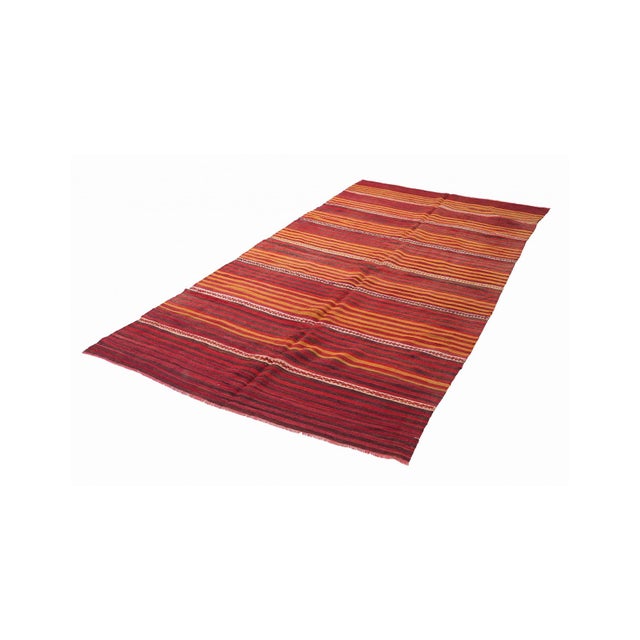 Handwoven vintage striped decorative kilim rug from Denizli region of Turkey. Approximately 50-60 years old. In very good...