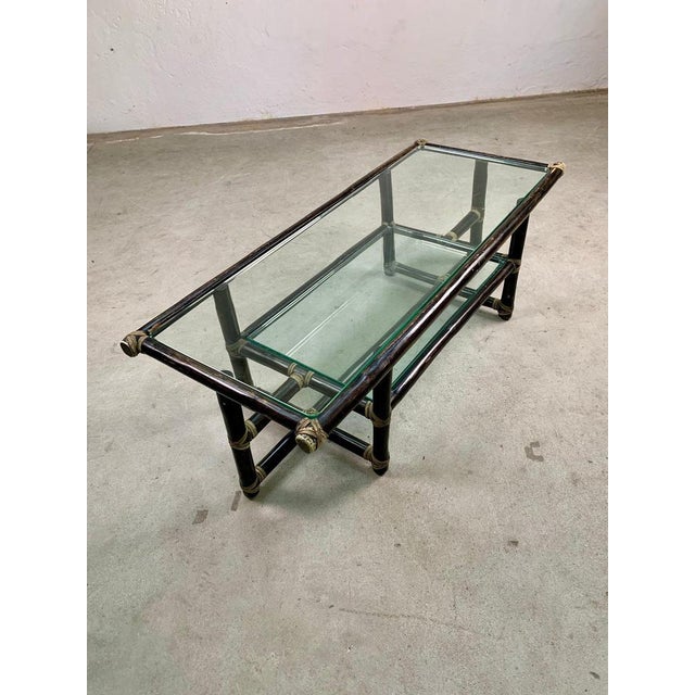 Bamboo coffee table by Lyda Levi for McGuire, 1960s Spelendid coffee table with two glass shelves and bamboo frame....