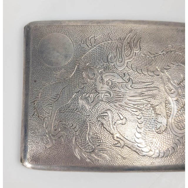We are selling this nice Chinese export 900 silver hallmarked cigarette case with incised dragon decoration. The inside of...