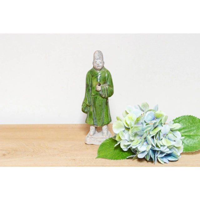 Lovely Sancai style pottery statue, a vintage depiction of a palace attendant in traditional Chinese artistry. The...