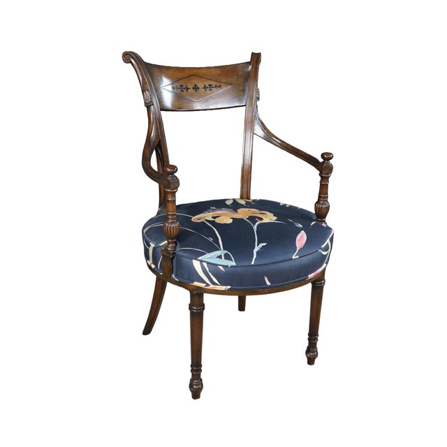 This pair of English Regency style mahogany armchairs from the first half of the 20th century showcases classic...