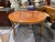 This 19th century French Directoire round dining table embodies refined simplicity and timeless elegance. Crafted in warm...