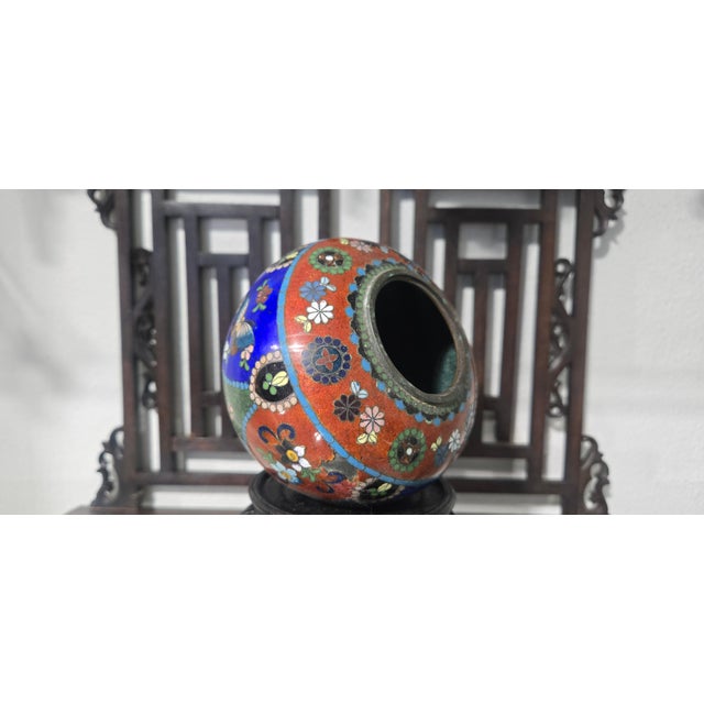 An impressive antique Japanese Meiji Period cloisonné enamel lidded tripod incense jar (koro), dating back to the late...