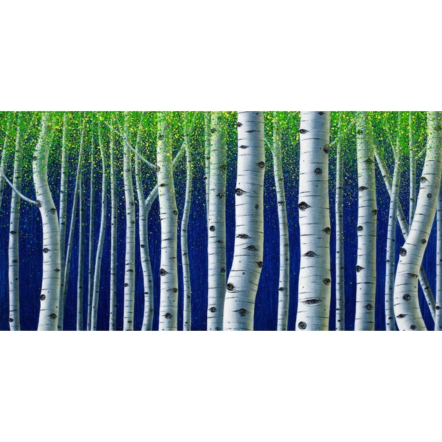 Deep Blue Forest presents a striking composition of slender, white birch trees set against a vibrant blue backdrop. The...
