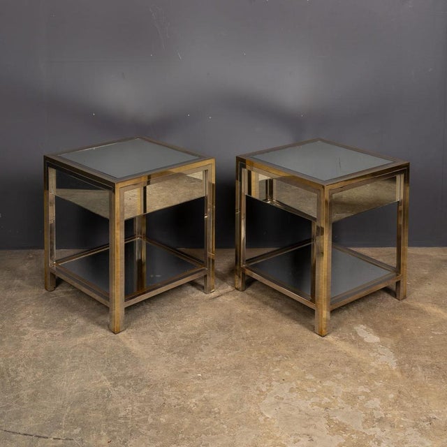 A 20th century classic pair of metal and brass end tables by belgian designers belgo chrome. These square tables feature...