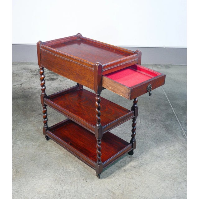 French shelf with three shelves, in oak wood, with drawer and wheels. Origin France Fuel Nineteenth century Ethegere with...