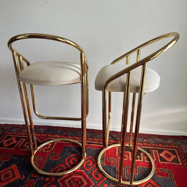 Bar stools by American of Martinsville. Tubular gold metal and a original upholstered seat. Please review photos and...