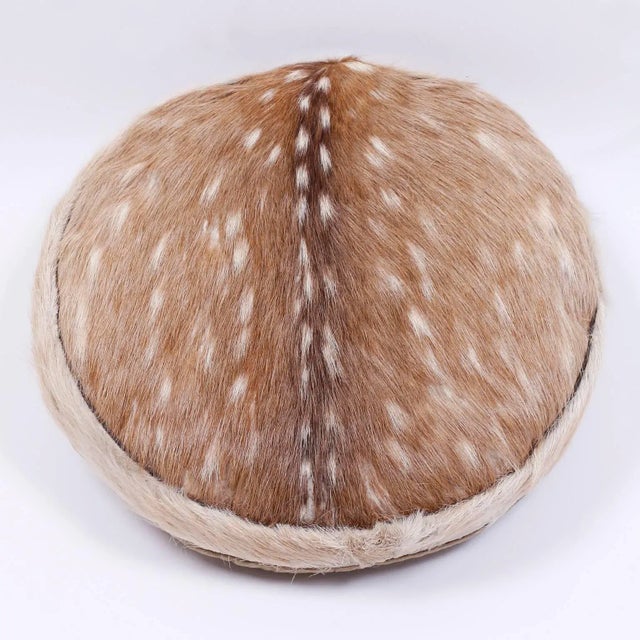 Round hand-made pillow crafted from the distinctive spotted chital or axis axis deer with a two button cotton back.