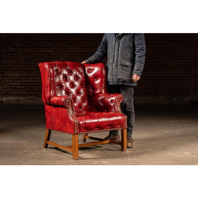 c. 1970s/1980s; Ethan Allen, Inc. - Beecher Falls, VT Classic leather wingback lounge chair paired with its original...