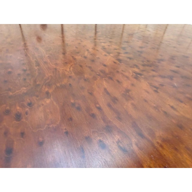 Extendable oval dining table in louis xvi style, made of mottled mahogany. the oval top is made of mottled mahogany with a...
