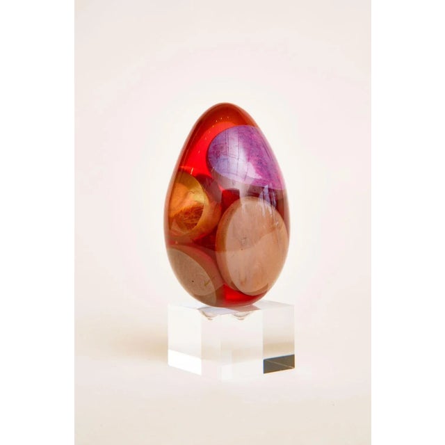 This most interesting resin sculpture is in ovoid form and from the 60's. The lucite carved in baae was custom made...