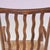This charming 1930s low spindle-back hearth chair, attributed to the Arts & Crafts tradition and retailed by Liberty &...