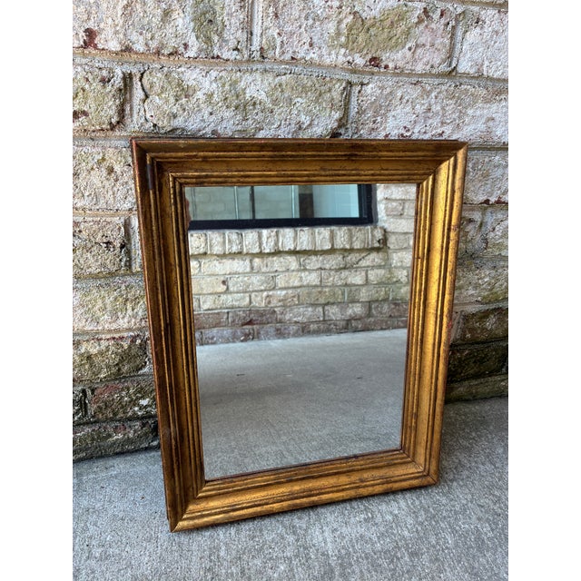 Italian gilt mirror, dating back to the 19th Century. The mirror itself has been replaced over time, but the gilt frame is...