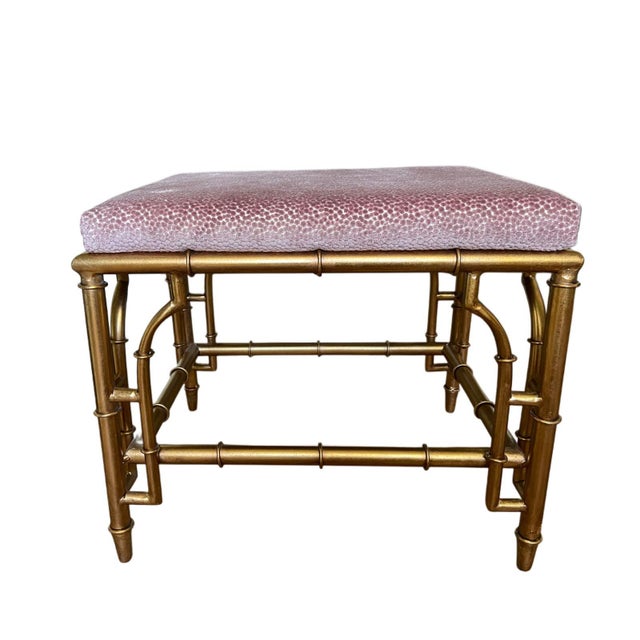 A refined set of Collette stools finished in warm gold, featuring an elegant faux-bamboo metal frame that evokes classic...