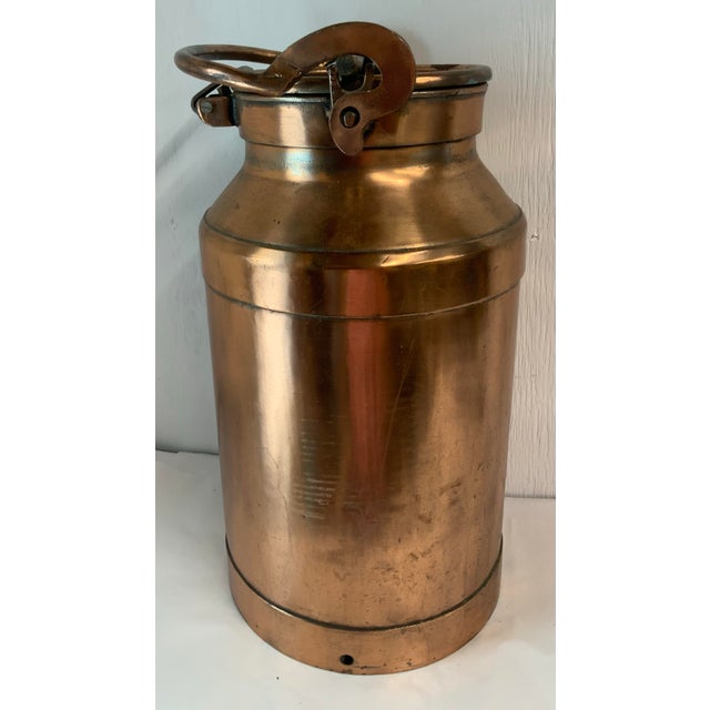 Love that vintage French copper milk can! Can be used for an umbrella or cane stand or a large planter