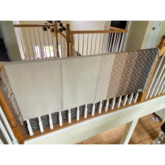 This very rich, large Italian throw, in a solid thru to herringbone pattern design in all neutral tones ending in a lite...