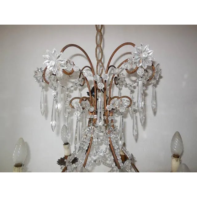 Housing an impressive 7 lights. Stars, balls, spars and flowers are all in crystal. Criss-cross beading. Flower florets,...