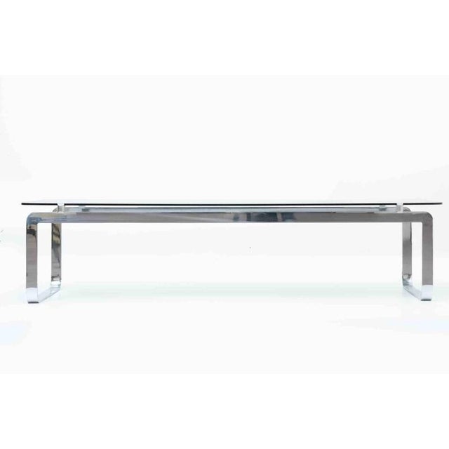 Low table model p42 realized by bernard govin for saporiti in 1960s. Structure in steel and table in smoked glass. A...
