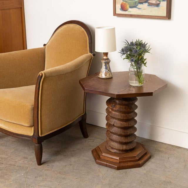 Impressive twisted wood gueridon table from France, 1940s. Rustic octagonal base, thick twisted wood stem, and large...