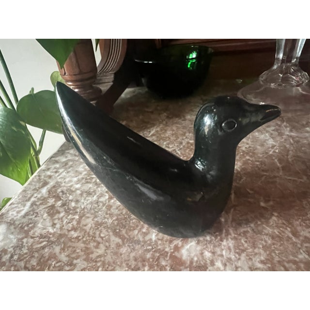 Heavy black stone bird figurine. Marked 550.