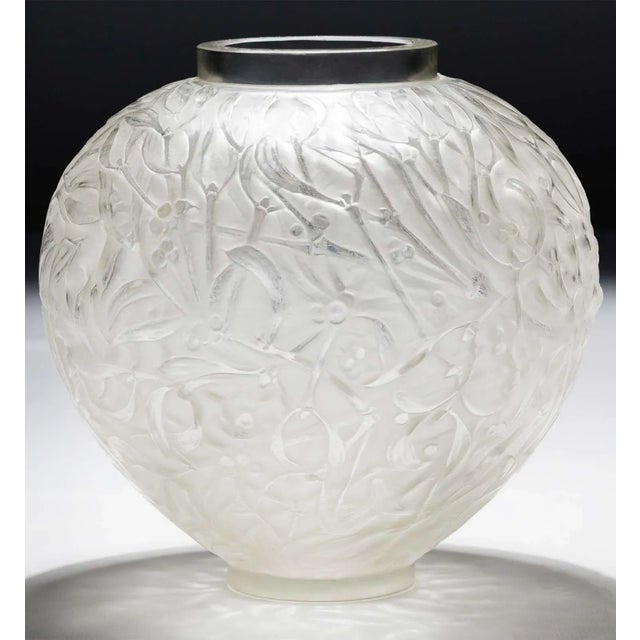 Vintage frosted glass vase by René Lalique made in France in the 1920's. The 'Gui' vase takes its name from the French...