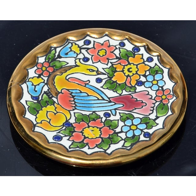 1980s Cearco hand-painted Spanish ceramic embossed Coaster, featuring a colorful bird surrounded by flowers and accented...