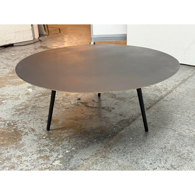 Design Plus Gallery presents the Trula Round Coffee Table from Four Hands. This contemporary table presents a broad...