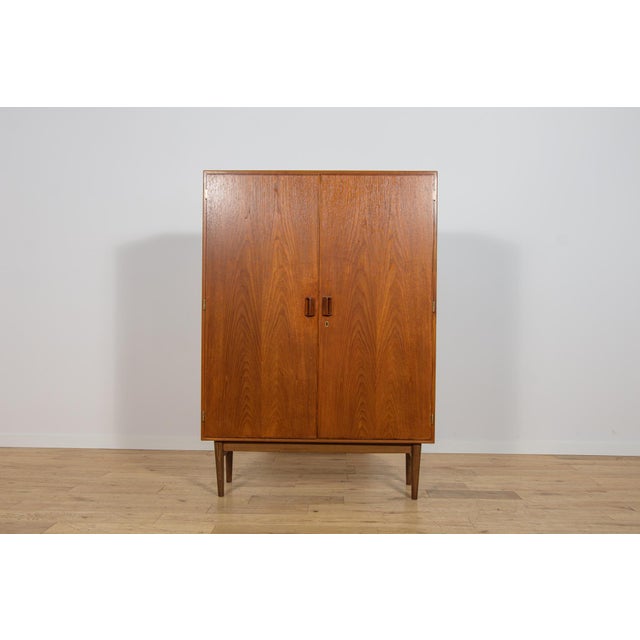 This wardrobe was designed by Børge Mogensen and manufactured by the Danish furniture maker Søborg Møbelfabrik during the...