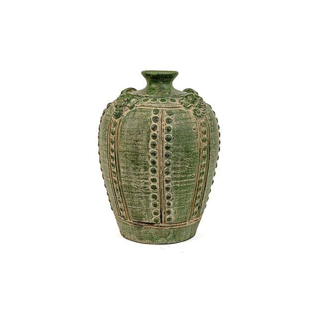 Large Primitive Antique Chinese Emerald Green Elephant Vase. Decorated with elephant heads and rows of circles....