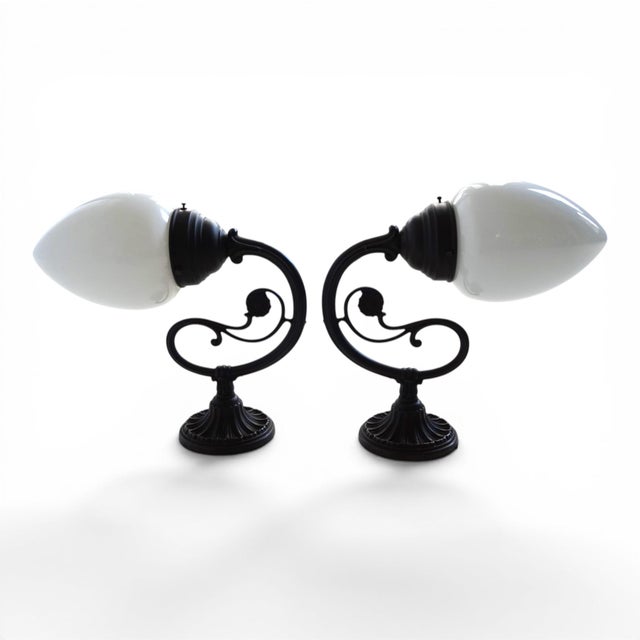 This beautiful pair of lamps in the elegant Art Nouveau style combines artistic design with high-quality craftsmanship and...