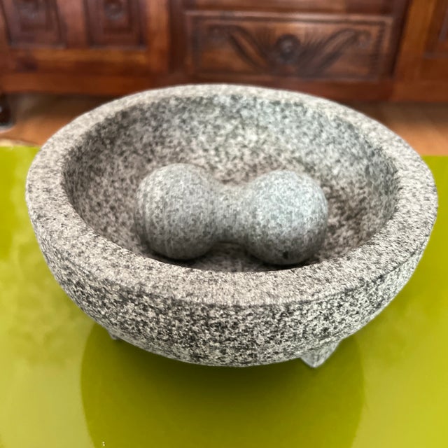Delve into the timeless art of handcrafted pottery with a vintage marble mortar and pestle. For centuries, artisans have...