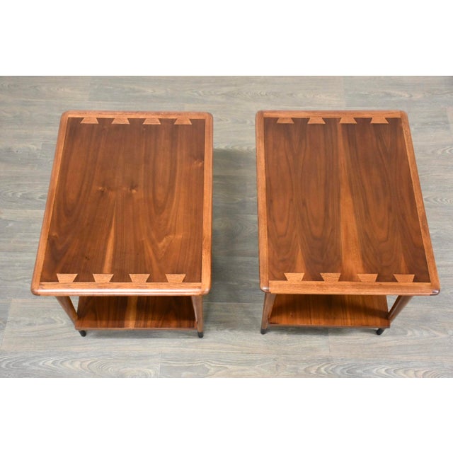 A pair of mid century modern walnut top end tables with ash dovetail details made by Lane Acclaim. Professionally...