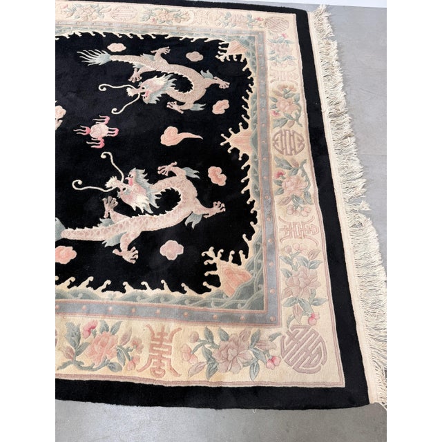 Bring timeless elegance and Eastern symbolism into your interior with this beautiful hand-knotted rug. Featuring an...