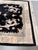 Bring timeless elegance and Eastern symbolism into your interior with this beautiful hand-knotted rug. Featuring an...