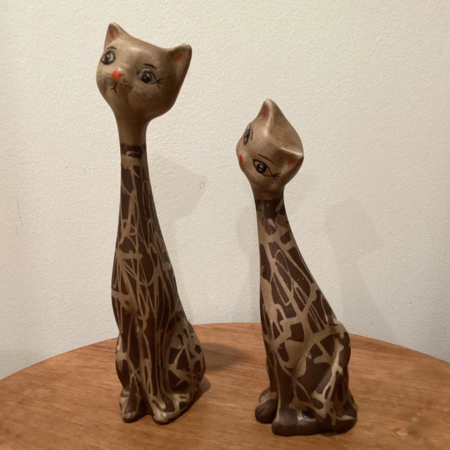 This is a lovely pair of ceramic cats made in Italy around 1950-1960. Commonly known as long neck cats, these were hand...