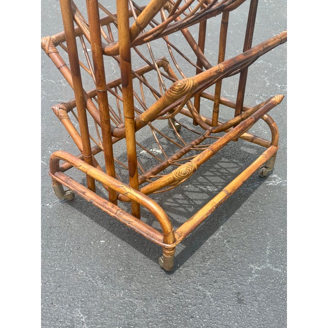 A beautifully crafted vintage Hollywood Regency rattan magazine rack with strong Italian Riviera influence and exceptional...