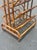A beautifully crafted vintage Hollywood Regency rattan magazine rack with strong Italian Riviera influence and exceptional...