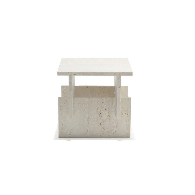 Auxiliary table made of travertine marble. All the parts of the table fit perfectly like a puzzle. The harmonically and...