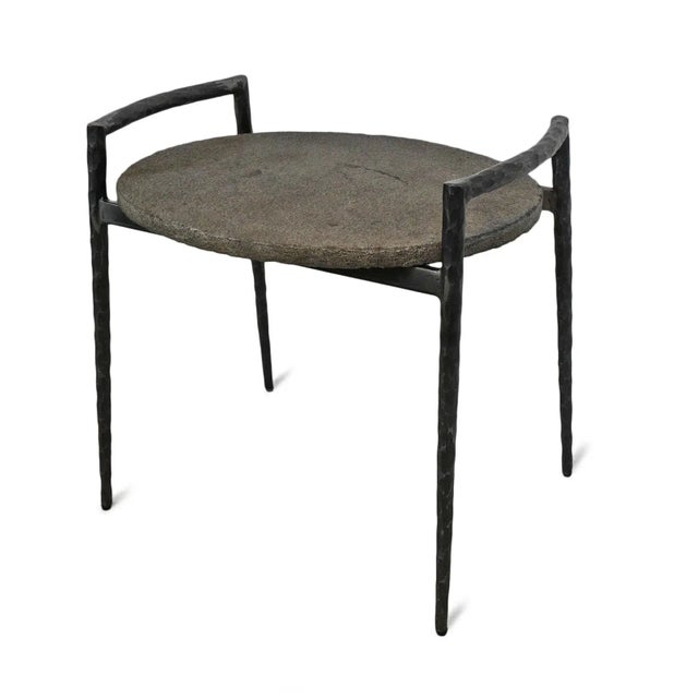 Handsome oval slate top end table with modern hand hammered iron frame. Each will vary in tones, textures, and...