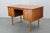 This danish mid-century modern writing desk dates from the 1960s and exemplifies the functional elegance and craftsmanship...