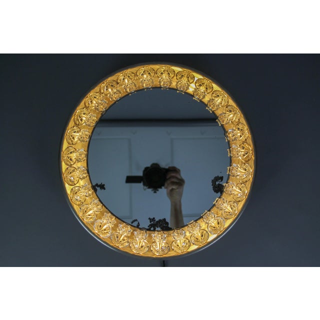 Very unusual and rare Mid-Century Modern or Industrial style illuminated backlit wall mirror. This impressive round wall...