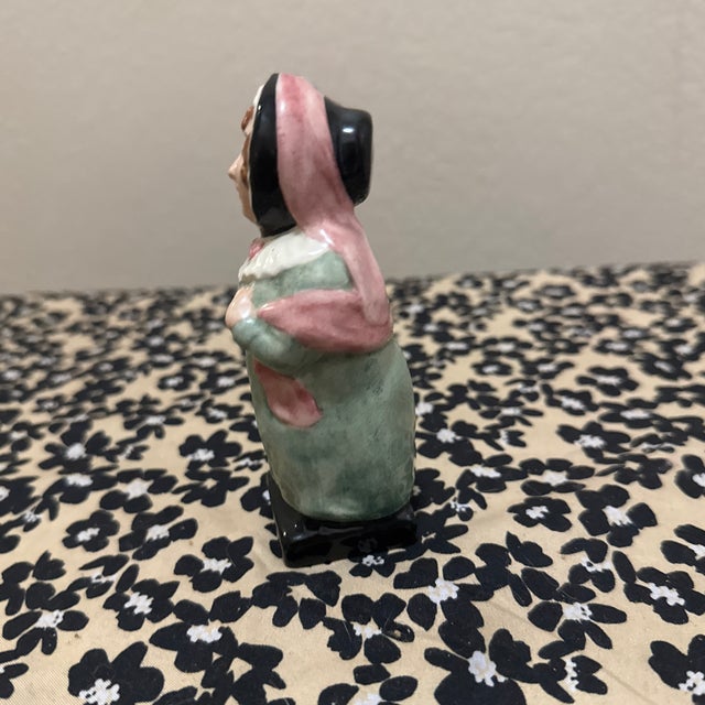 Add a touch of classic literary charm to your collection with this beautiful Royal Doulton figurine of Mrs. Bardell, a...